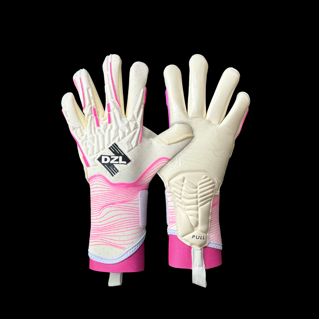 Pink goalkeeper gloves on a football pitch